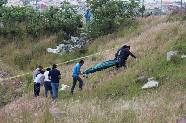 Hallan cadáver de mujer ultimada a golpes en el Periférico Ecológico