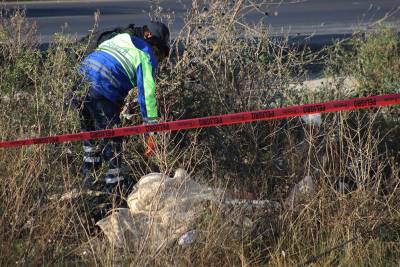 Hallan cadáveres de dos hombres ejecutados en el Periférico Ecológico