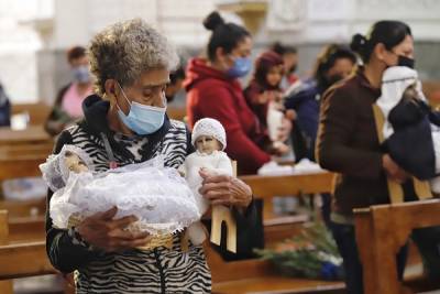 FOTOS: Acuden poblanos a iglesias para bendecir a sus Niños Dios