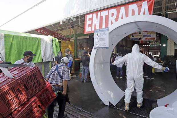 Casos asintomáticos de COVID-19 propiciaron brote en Central de Abasto de Puebla