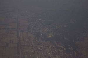 FOTOS. Así se ve desde al aire la &quot;nata&quot; de contaminación sobre Puebla y el Valle de México