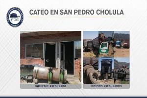 Localizan camionetas y camiones de carga robados tras cateo a bodega en San Pedro Cholula